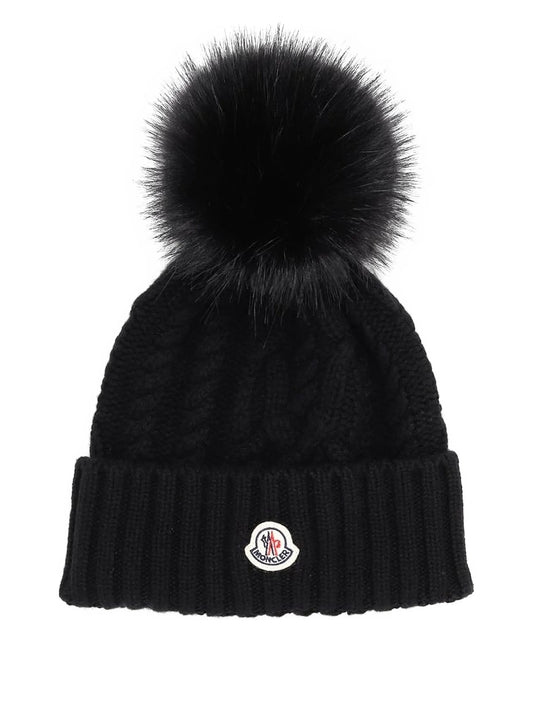 Moncler bonnet en maille torsadée à pompon